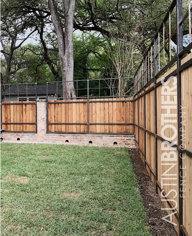 Cedar horizontal privacy fence around a backyard lawn