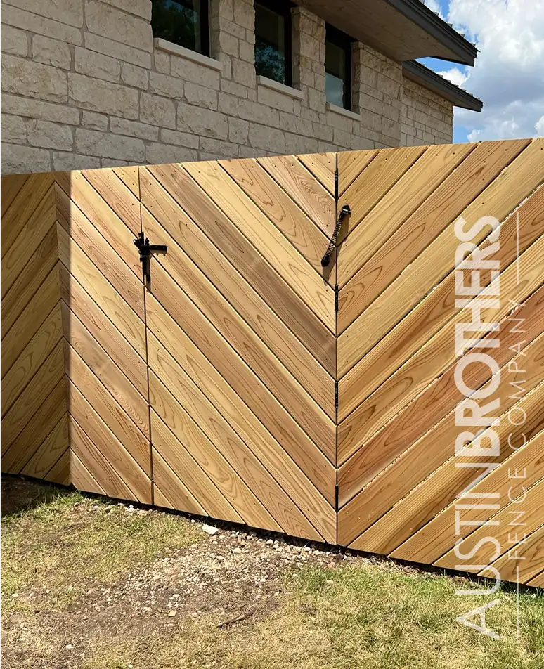 Cedar double gate with a diagonal chevron board pattern